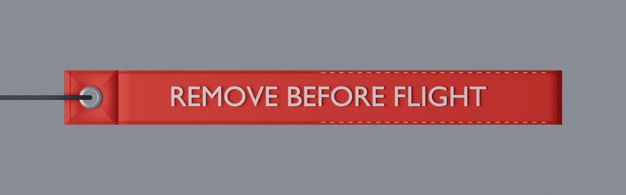 Red tag reading REMOVE BEFORE FLIGHT